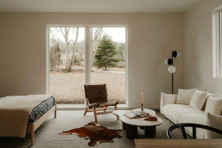 Modern living space with large window overlooking nature